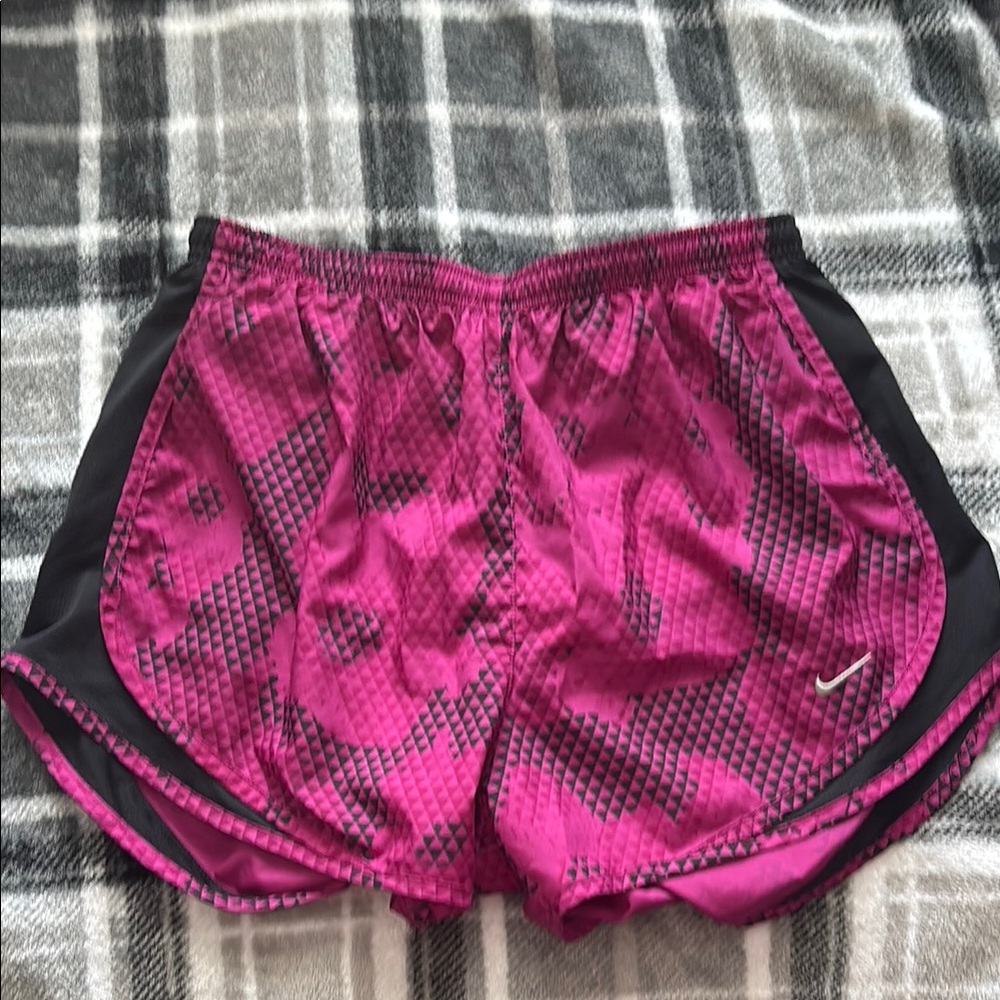 Pink and black Nike shorts